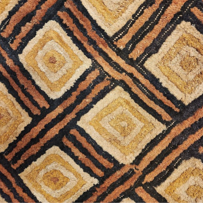 Kuba Raphia Candle: A Sweet Escape to the Heart of the Congo